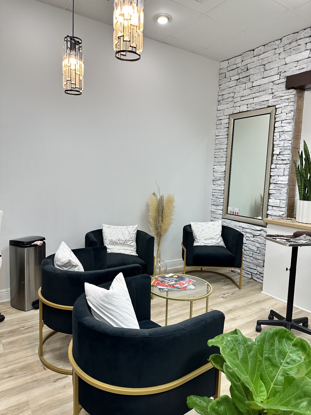 Musart Salon lounge with navy velvet chairs, gold accents and crystal pendant lights
